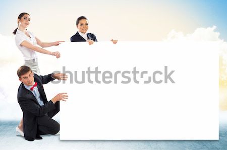 small group of people holding a blank banner Stock photo © adam121