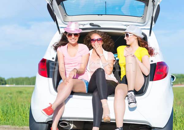 young attractive woman sitting in the open trunk Stock photo © adam121