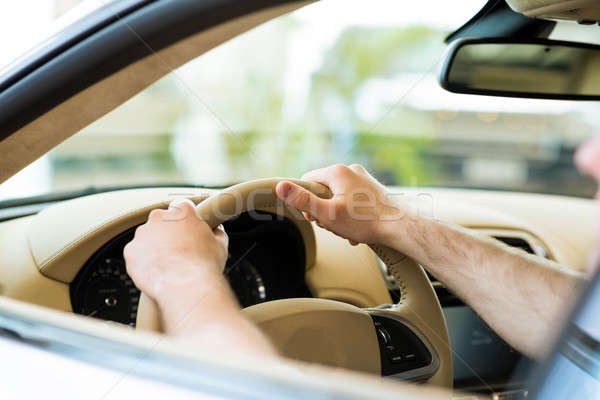 male hand holding a car wheel Stock photo © adam121