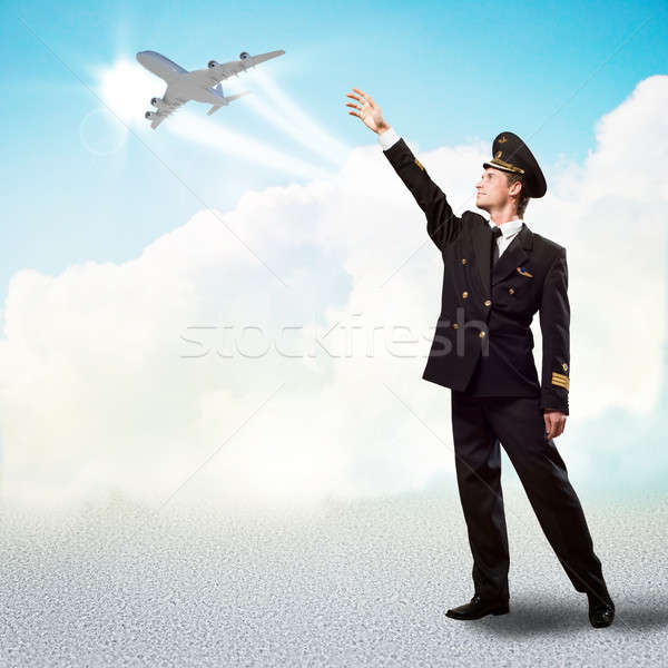 pilot in the form of extending a hand to airplane Stock photo © adam121
