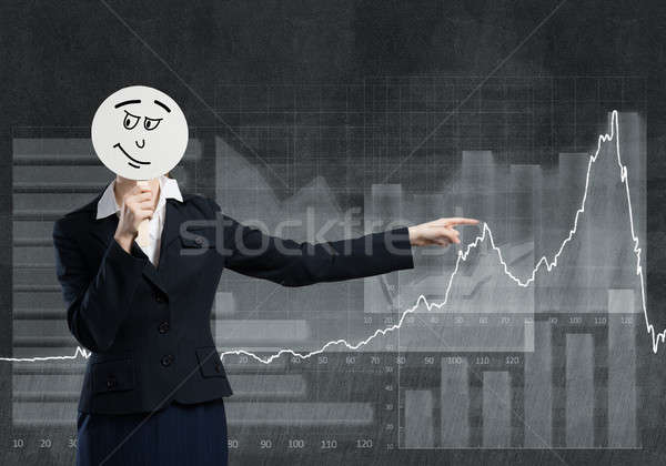 Felismerhetetlen üzletasszony grafikonok rejtőzködik arc mögött Stock fotó © adam121