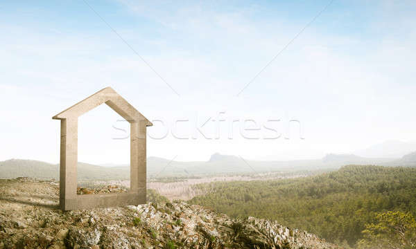 Conceptual image of concrete home sign on hill and natural lands Stock photo © adam121