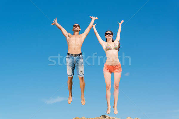 young couple jumping together Stock photo © adam121
