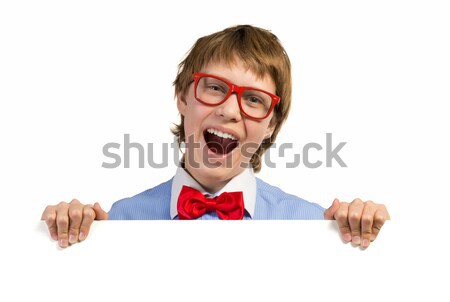 Stock photo: boy with glasses holding a white placard