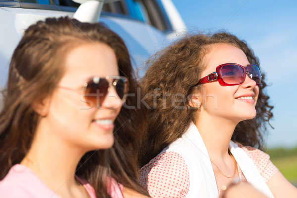 Two attractive young women wearing sunglasses Stock photo © adam121