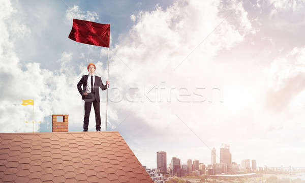 Young businessman with flag presenting concept of leadership. Mi Stock photo © adam121
