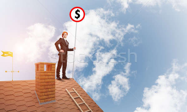 Businessman on house roof showing roadsign with money concept and looking at city. Mixed media Stock photo © adam121