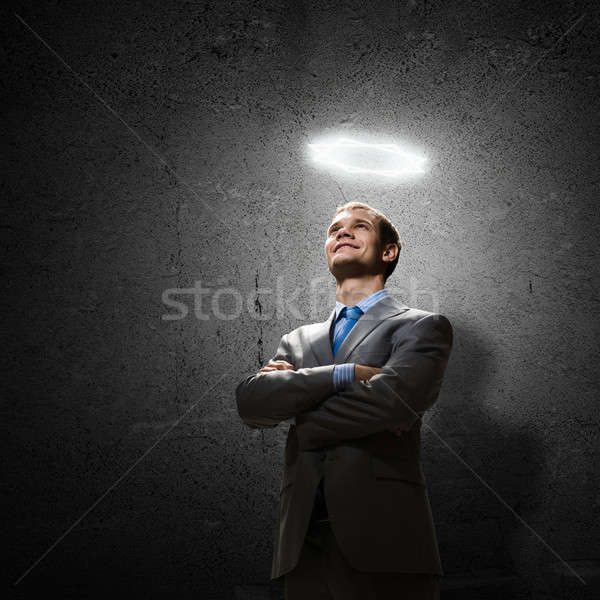 Empresário jovem bonito halo acima Foto stock © adam121