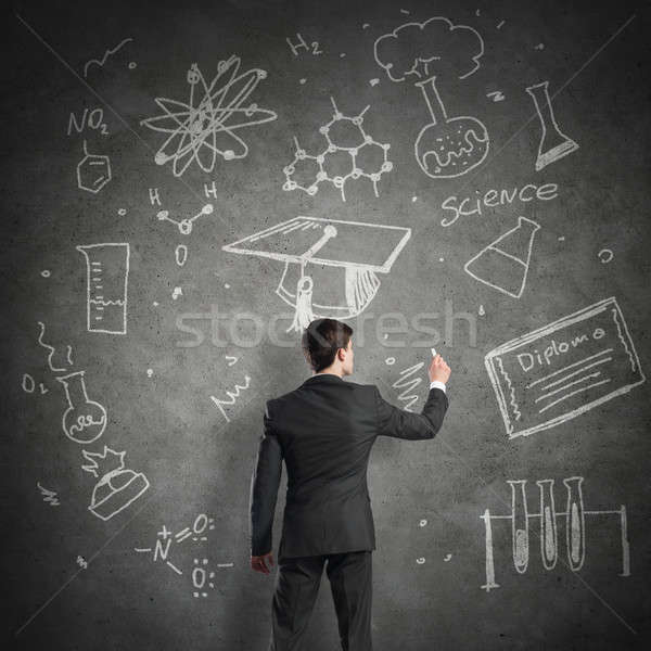 Stockfoto: Wetenschapper · schrijven · formules · schoolbord · jonge · man · pak