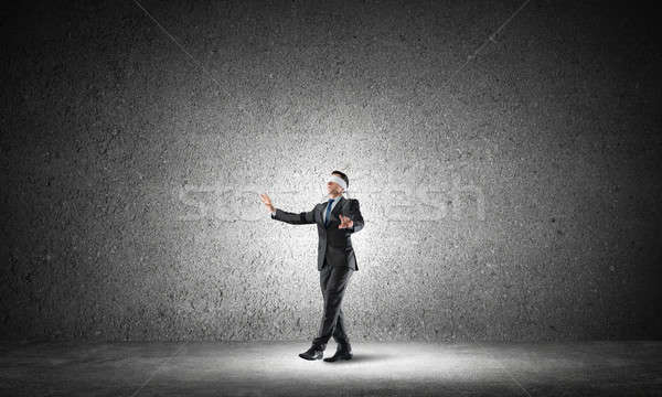 Business concept of risk with businessman wearing blindfold in empty concrete room Stock photo © adam121