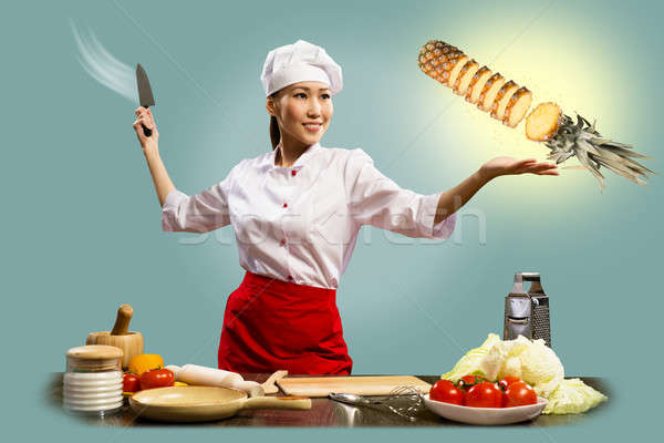 Asian female chef cuts pineapple Stock photo © adam121