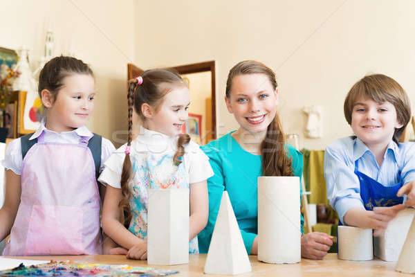 children with the teacher engaged in painting Stock photo © adam121
