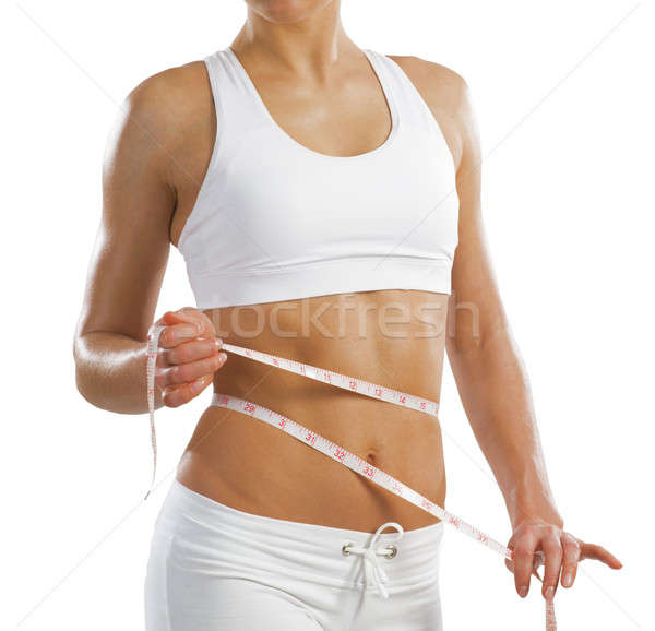 young athletic woman measuring waist Stock photo © adam121