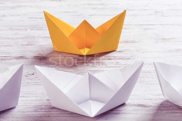 Business leadership concept with white and color paper boats on  Stock photo © adam121