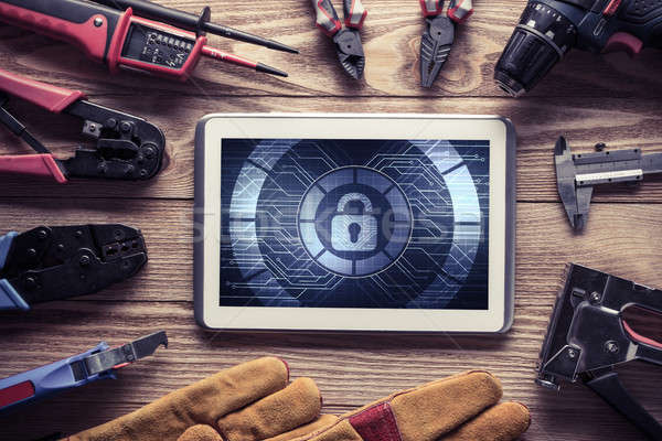 Web security and technology concept with tablet pc on wooden tab Stock photo © adam121