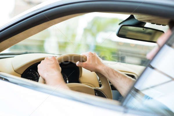 male hand holding a car wheel Stock photo © adam121