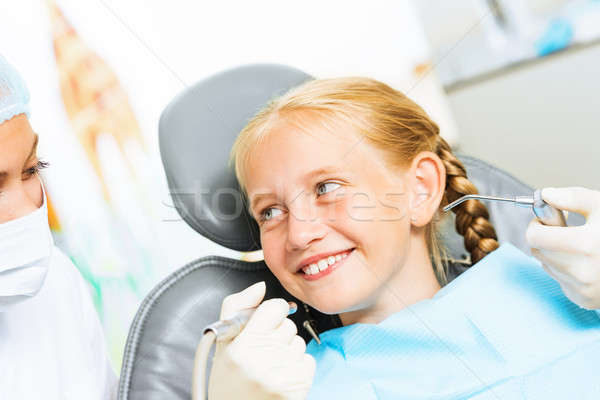 Dentist inspecting patient Stock photo © adam121