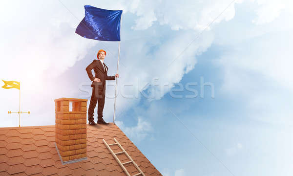 Young businessman with flag presenting concept of leadership. Mixed media Stock photo © adam121