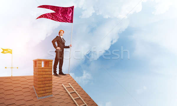 Young businessman with flag presenting concept of leadership. Mixed media Stock photo © adam121