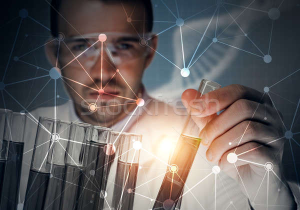 Stock photo: Portrait of concentrated male scientist working with reagents in laboratory