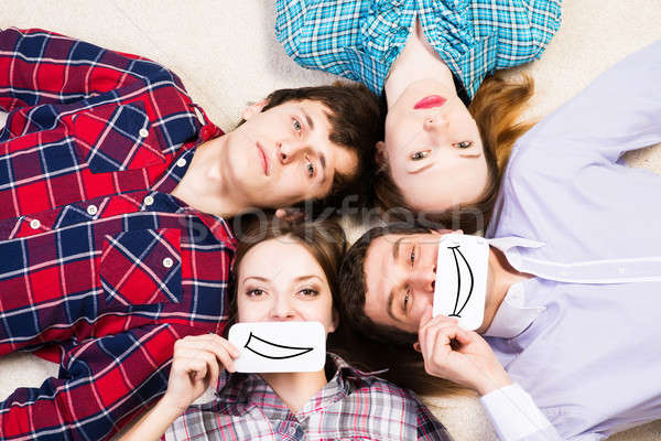 four young men lie together Stock photo © adam121