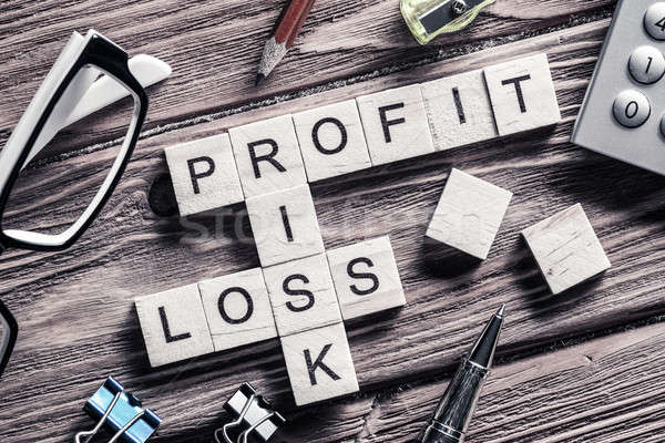 Profit loss and risk words on workplace collected of wooden cube Stock photo © adam121