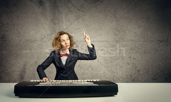 Mad woman play piano Stock photo © adam121