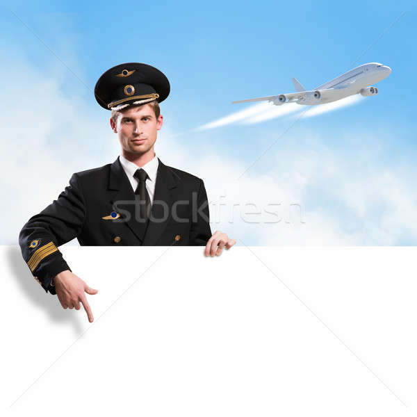 Pilóta űrlap tart üres óriásplakát égbolt Stock fotó © adam121