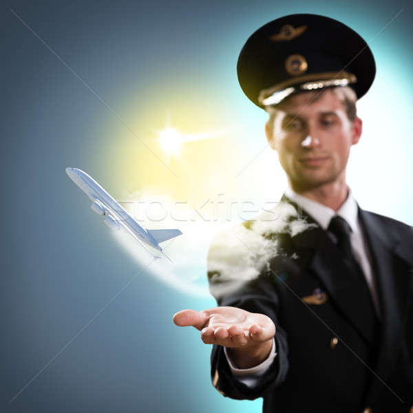 pilot in the form of extending a hand to airplane Stock photo © adam121