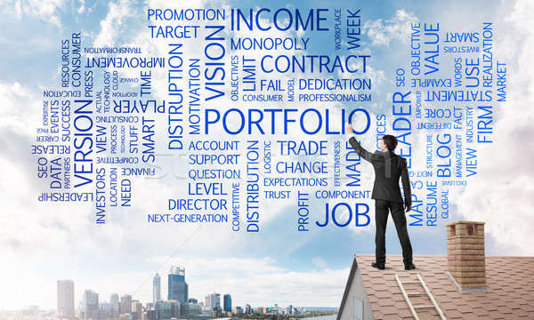 Young businessman standing on house roof and writing leadership skill concept. Mixed media Stock photo © adam121