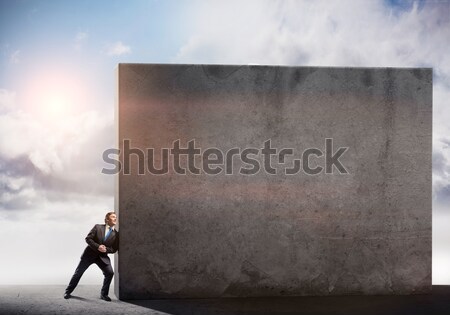 бизнесмен стены молодые усилие Сток-фото © adam121