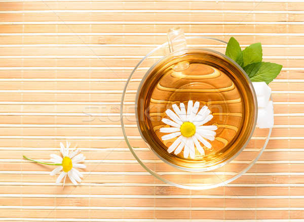 Stock photo: teacup with herbal chamomile tea