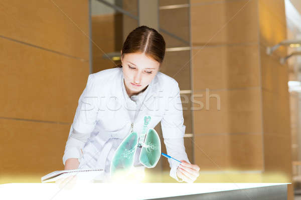 young woman doing research Stock photo © adam121