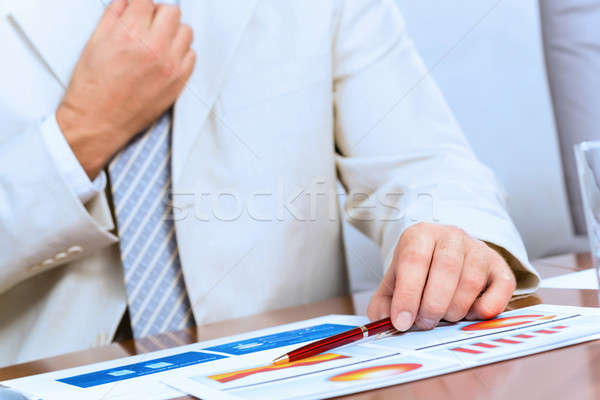 Stock photo: businessman corrects a tie themselves