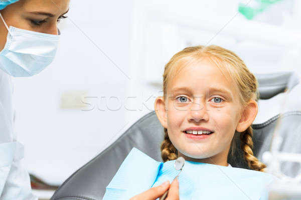 Dentist inspecting patient Stock photo © adam121