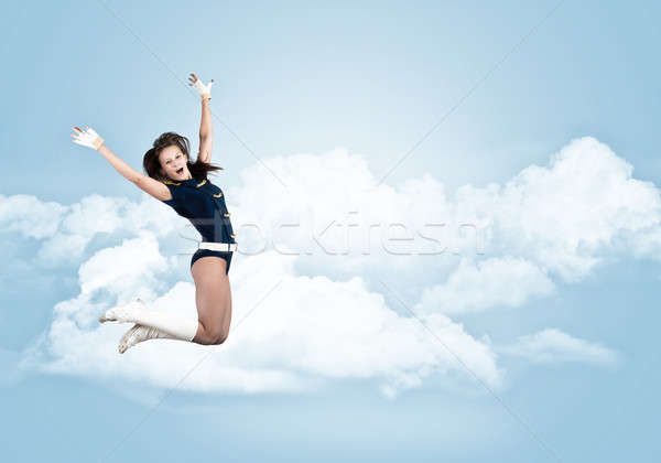 Majoreta fată tineri frumos zâmbitor jumping Imagine de stoc © adam121