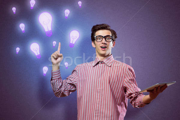 young man holding a tablet Stock photo © adam121