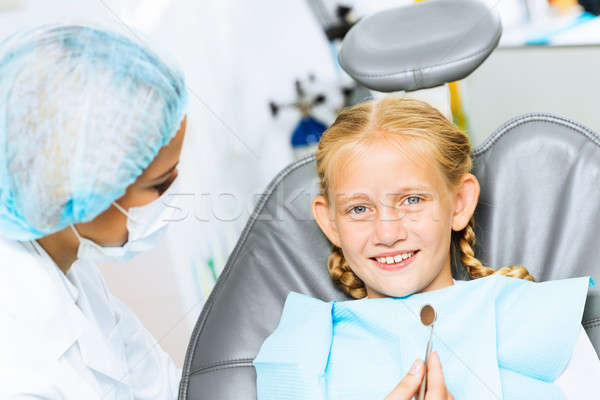 Dentist inspecting patient Stock photo © adam121