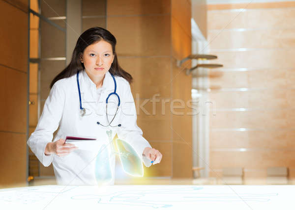 young woman doing research Stock photo © adam121
