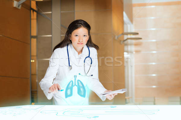 young woman doing research Stock photo © adam121