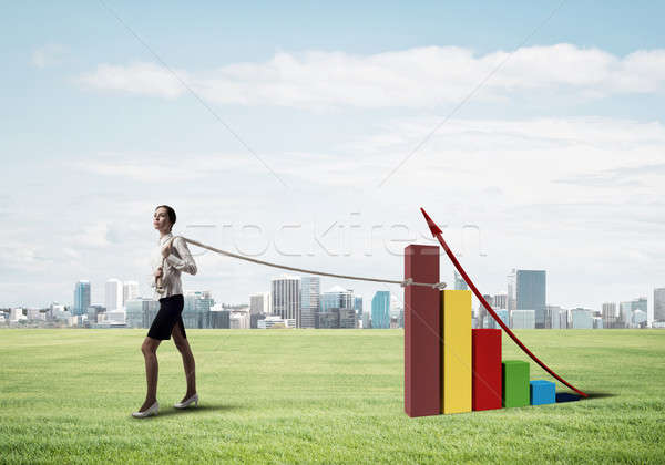 Businesswoman pulling arrow with rope and making it raise up Stock photo © adam121