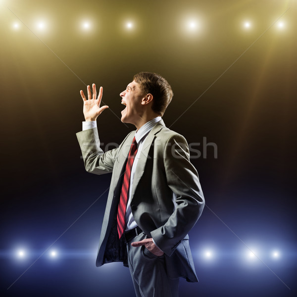 Businessman with microphone Stock photo © adam121