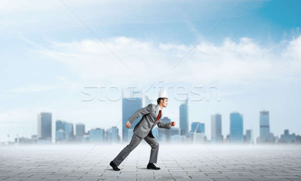 King businessman in elegant suit running and business center at background Stock photo © adam121