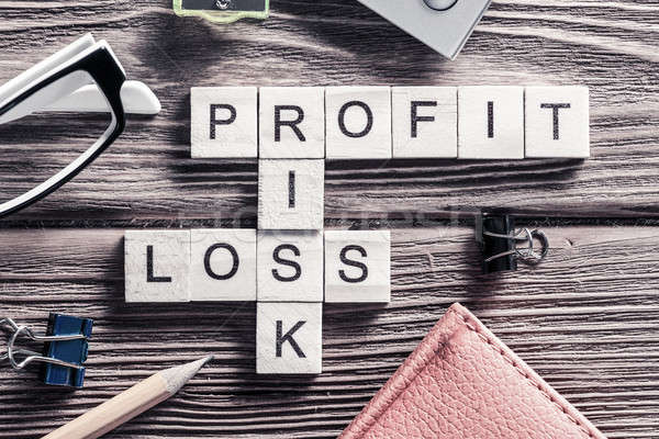 Stock photo: Profit loss and risk words on workplace collected of wooden cube