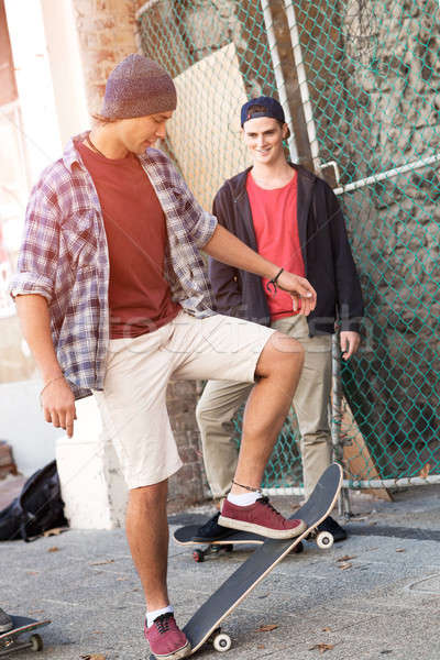 Guys skateboarders in street Stock photo © adam121