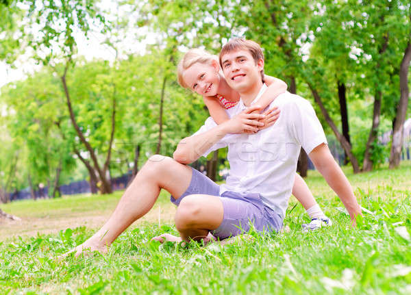 Father and daughter sitting together on the grass Stock photo © adam121