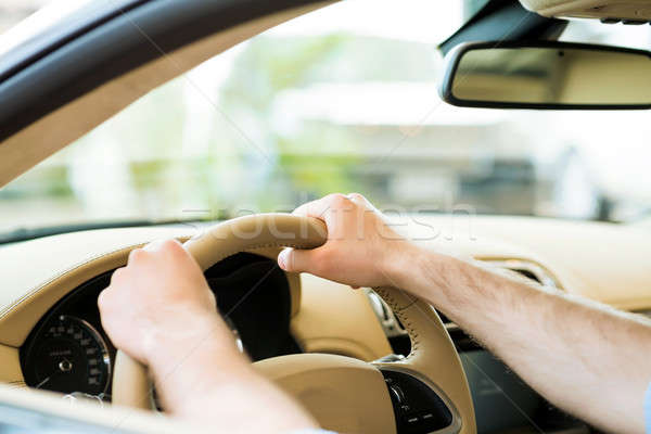 male hand holding a car wheel Stock photo © adam121