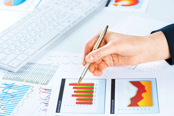 female hand pointing to the financial growth chart Stock photo © adam121