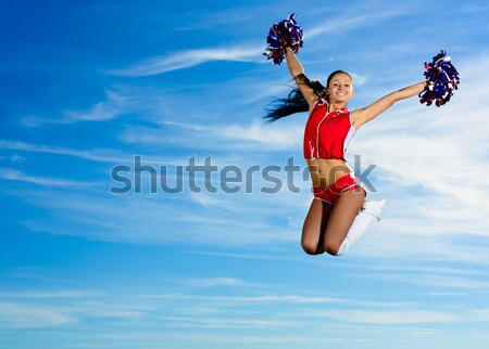 Majoreta fată jumping Blue Sky modă sări Imagine de stoc © adam121