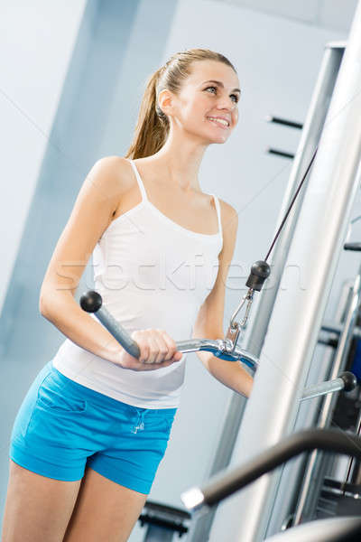 young woman doing body-building in the Gym Stock photo © adam121